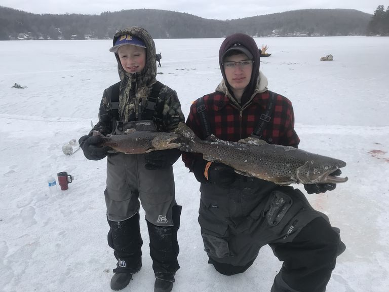 Ice fisherman showing off their catch on Lake St. Catherine